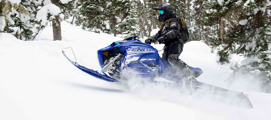 Yamaha Snow Mobile, found at Pickering Mower, going up a mountain